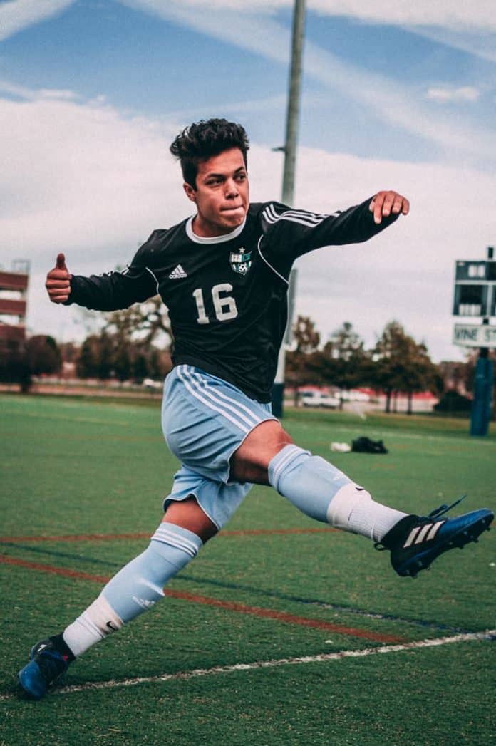 Soccer player, captured at a high shutter speed to freeze the moment.