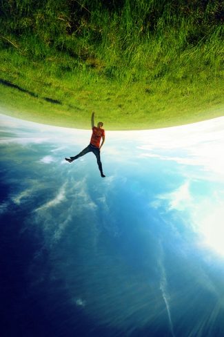 Forced perspective image of a man holding the earth