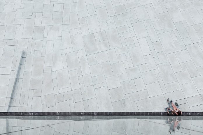 Forced perspective photography of a sitting couple