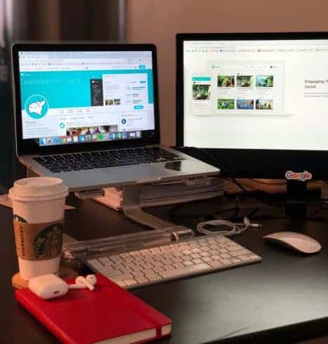 The ideal setup: coffee, laptop, desktop monitor. Managing your social media channels will take time, but it can be worth the investment when done right.