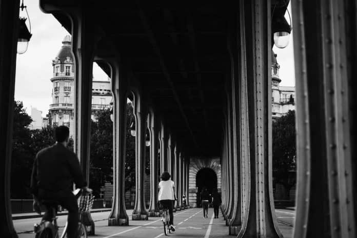 People riding bikes on Bir Hakeim Bridge, Paris
