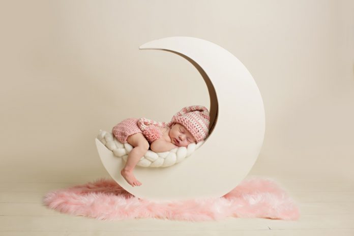 baby on prop newborn photography tips