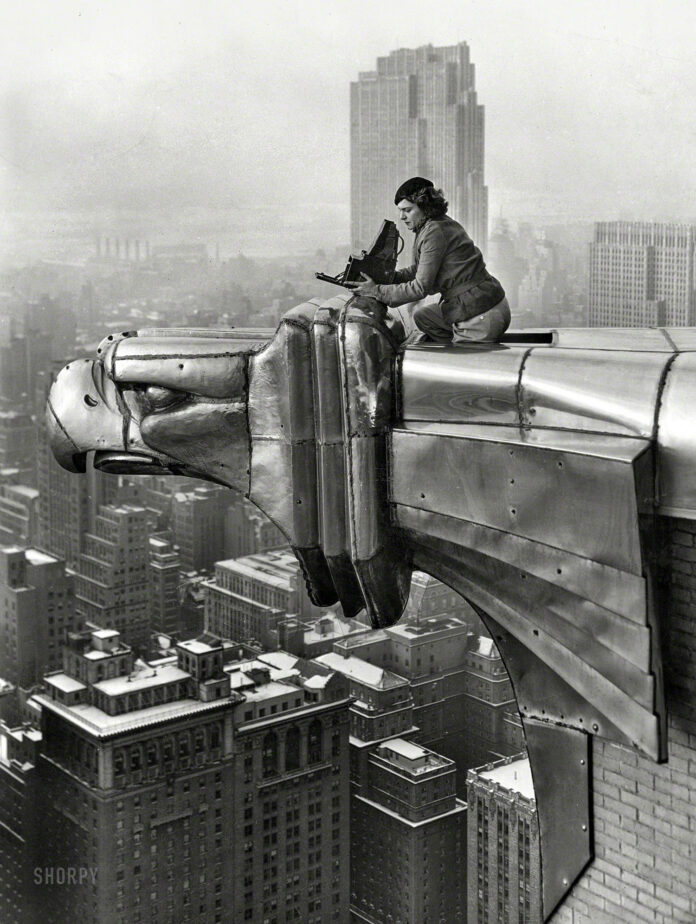 Margaret Bourke-White atop the Chrysler Building. c. 1930 in black and white.