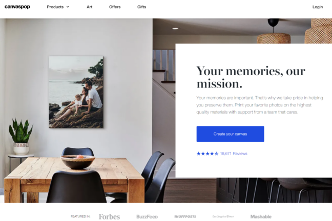 Canvaspop website displaying "Your memories, our mission" over a house interior with a print on the wall.