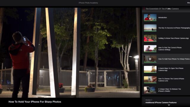 The iPhone Photo Academy course with a still of an instructor photographing at night.