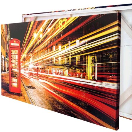 Pictorem canvas print of London street at night with light trails from cars and red phone booth.