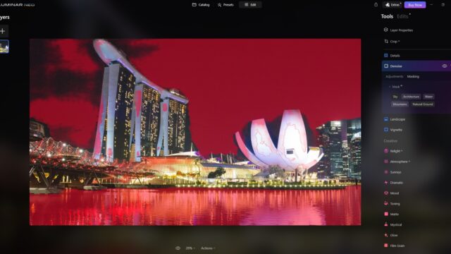 Luminar Neo main editing window with an urban night photo featuring a red overlay and the Denoise masking tools in use.