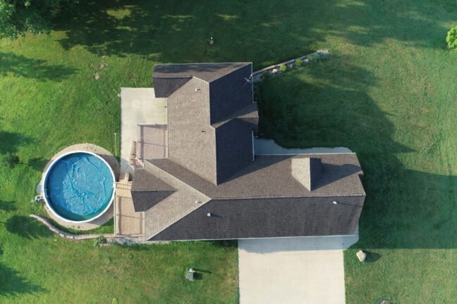 Aerial Overhead Shot of House, yard, and pool. Real estate photography using a drone.