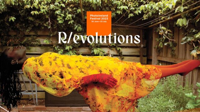 PhotoIreland Festival website main page with a levitating woman dressed in yellow.