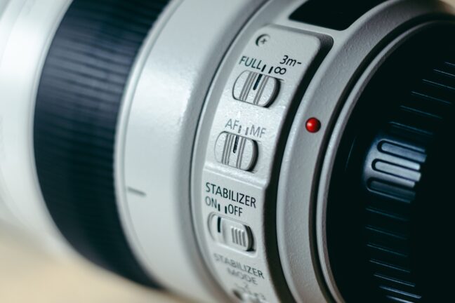 Canon telephoto zoom lens 100-400 millimeter with control switches in close up view.