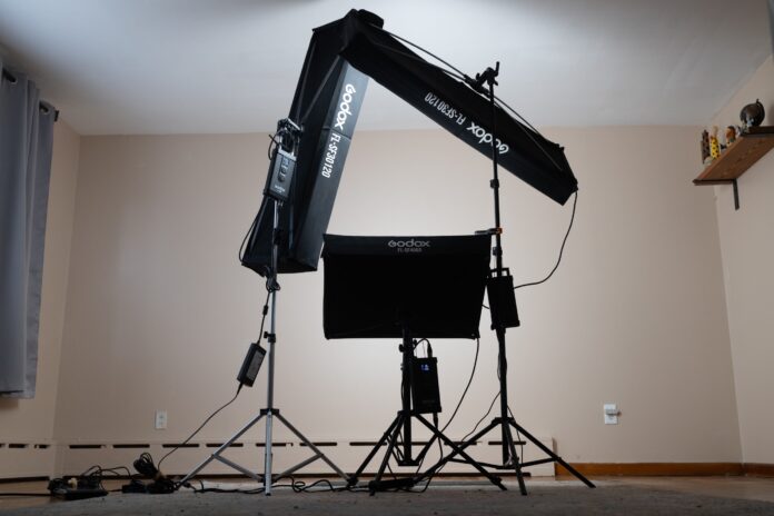 Triangle lighting setup for headshots with main light, fill light, and bottom fill light.