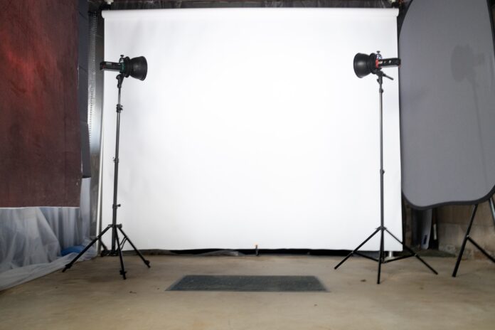 Headshot photography lighting setup with white background and two lights.