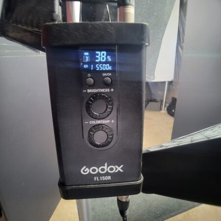 A close-up of a Godox FL150R light control panel displaying brightness at 38% and color temperature at 5500K.